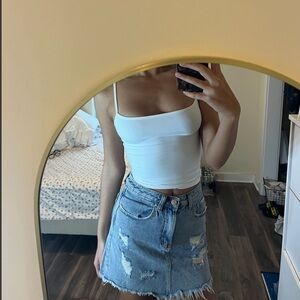 Distressed denim mini skirt